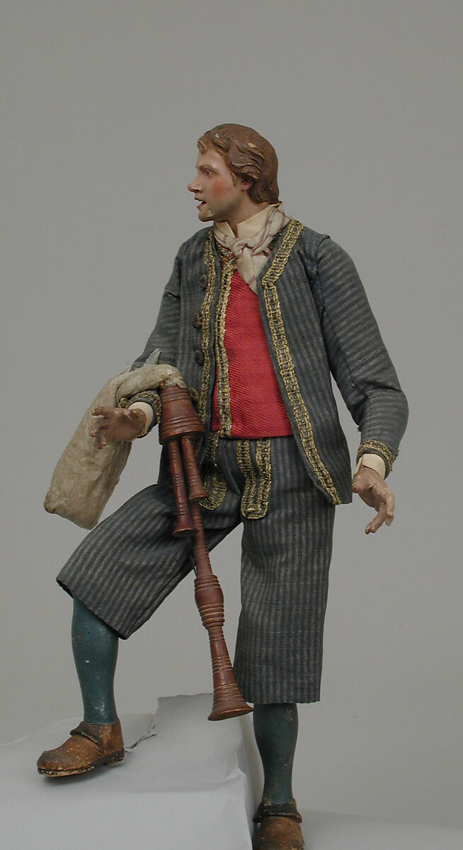 Young man in suit with bagpipes, Polychromed terracotta head; wooden limbs and bagpipes; body of wire wrapped in tow; garments of various fabrics