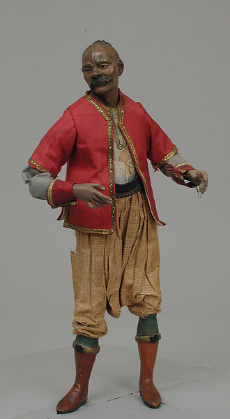 Oriental man, Polychromed terracotta head; wooden limbs; body of wire wrapped in tow; silk garments with metallic thread and other materials; glass eyes; silver scimitar