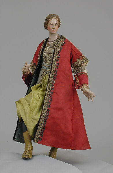 Oriental woman, Polychromed terracotta head; wooden limbs; body of wire wrapped in tow; silk garments with metallic thread and other materials; glass eyes