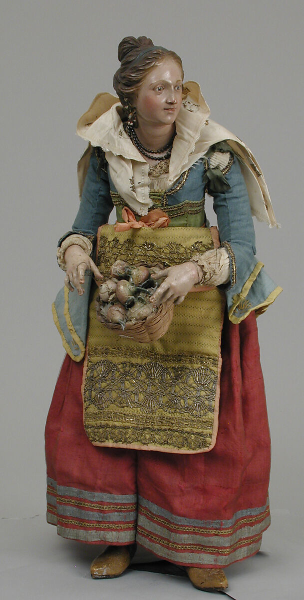 Girl carrying basket of onions, Polychromed wood and terracotta; raffia, cloth and straw, pearls