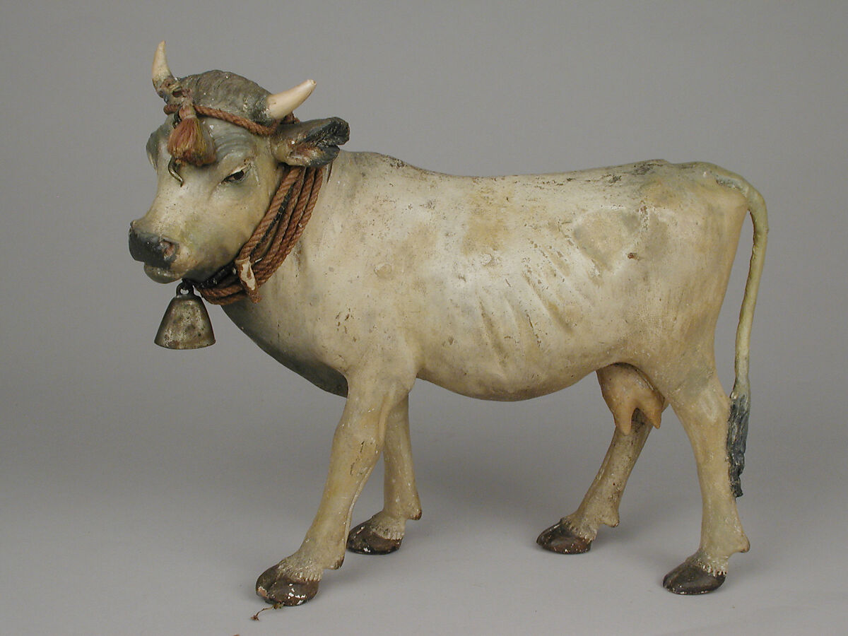 Standing cow, Polychromed terracotta, twine, brass bell
