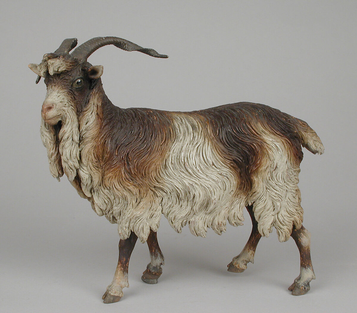 Male adult goat, Polychromed terracotta body, wooden legs, metal horns