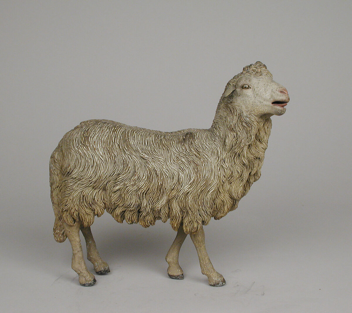 Standing sheep, Polychromed terracotta body, lead ears and legs