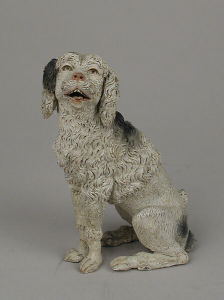 Seated poodle, Polychromed terracotta body with glass eyes