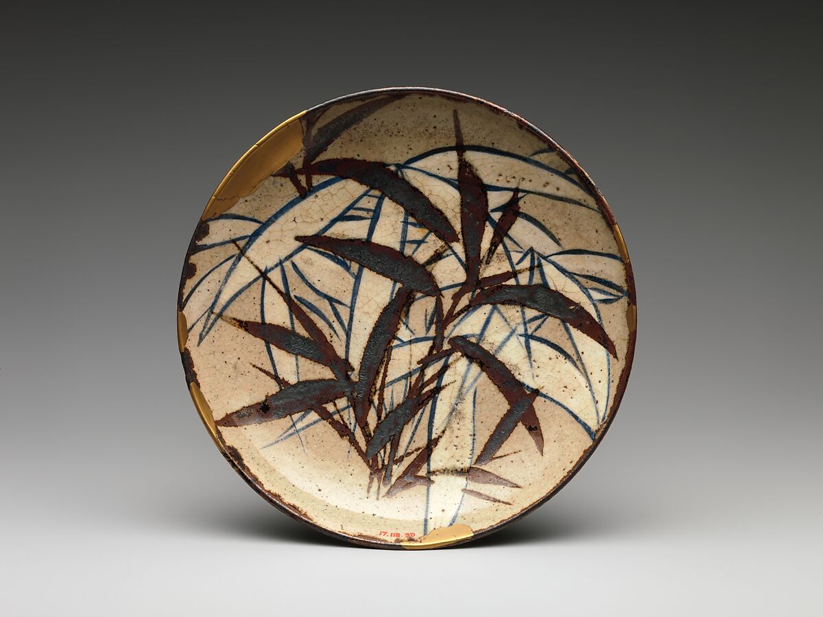 Dish with Bamboo Leaves, Ogata Kenzan 尾形乾山, Stoneware painted with cobalt blue, cream and iron‑brown slip under a transparent glaze; gold lacquer repair (kintsugi), Japan