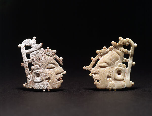 Pair of carved ornaments with the Maize God
, Shell, Maya