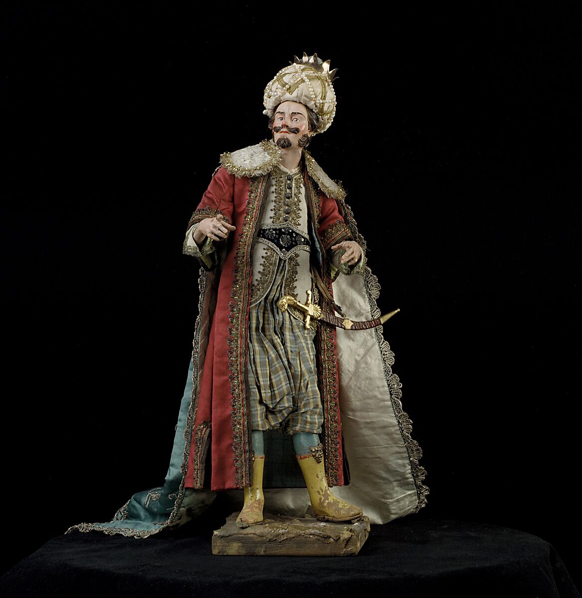 King, Nicola Ingaldi, Polychromed terracotta head and wooden limbs; body of wire wrapped in tow; satin, silk and velvet garments; silver and metallic thread; silver-gilt sword and crown; leather sheath