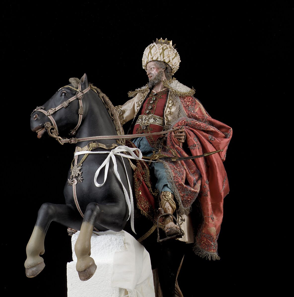 Elderly king, Polychromed terracotta head and wooden limbs; body of wire wrapped in tow; silk and satin garments; silver and gold metallic thread; glass buttons; silver-gilt sword, hilt and crown; leather sheath