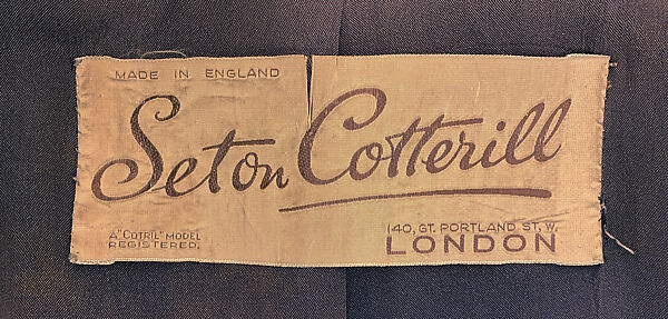 Suit, wool, plastic, American or European