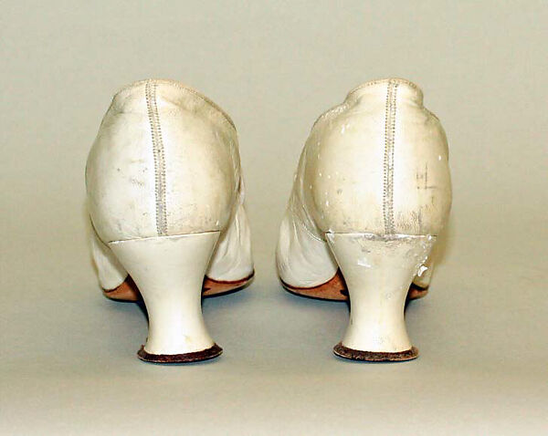 Wedding ensemble, Flaven (American), a) silk, wax
b,c) leather, metal, silk
d) wax, American