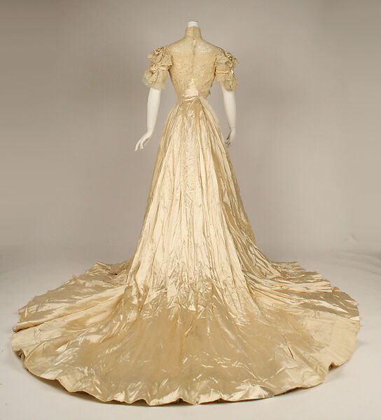 Wedding ensemble, Flaven (American), a) silk, wax
b,c) leather, metal, silk
d) wax, American