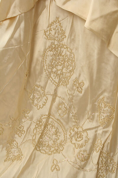 Wedding ensemble, Flaven (American), a) silk, wax
b,c) leather, metal, silk
d) wax, American