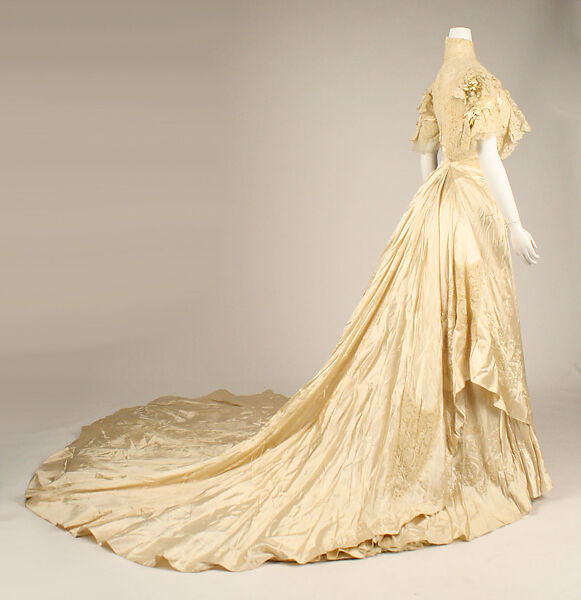 Wedding ensemble, Flaven (American), a) silk, wax
b,c) leather, metal, silk
d) wax, American