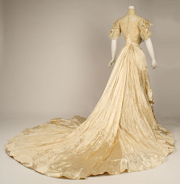 Wedding ensemble, Flaven (American), a) silk, wax
b,c) leather, metal, silk
d) wax, American