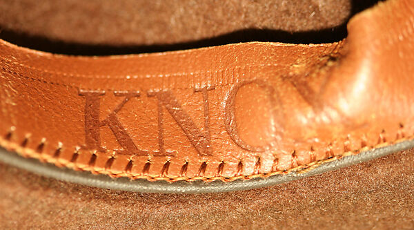 Fedora, (a) cardboard
(b) wool, American