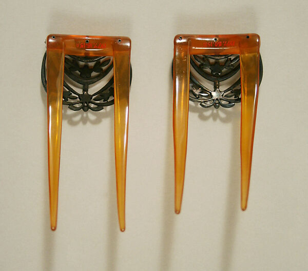 Comb, plastic (cellulose nitrate), metal, glass, probably European