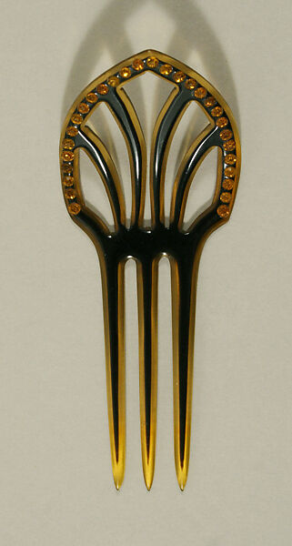 Comb, plastic (cellulose nitrate), glass, American or European 