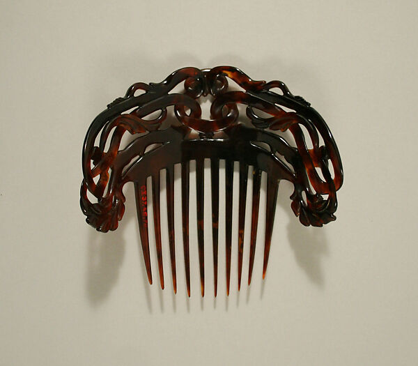 Comb, plastic (cellulose nitrate), American