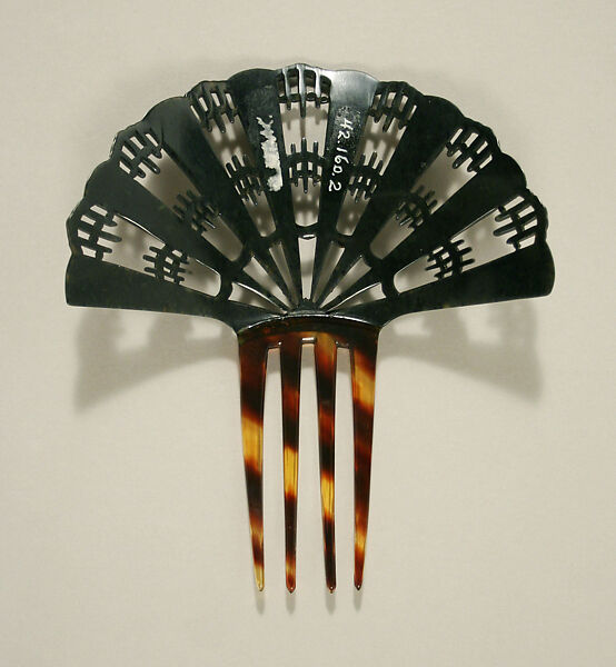 Comb, plastic (cellulose nitrate), American