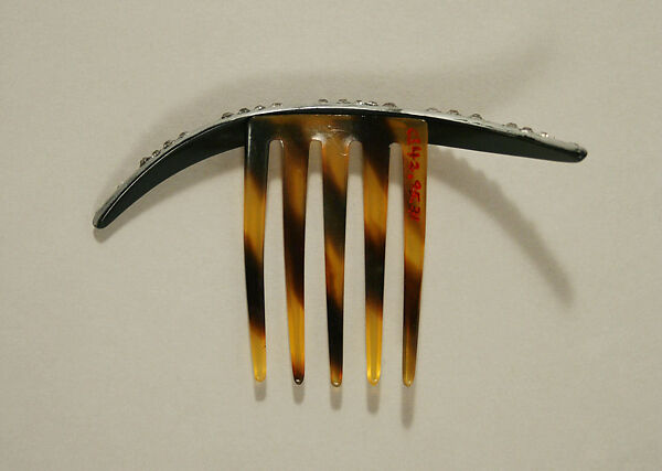 Comb, plastic (cellulose nitrate), metal, American