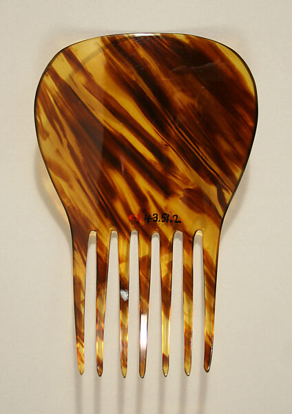 Comb, plastic (cellulose nitrate), American