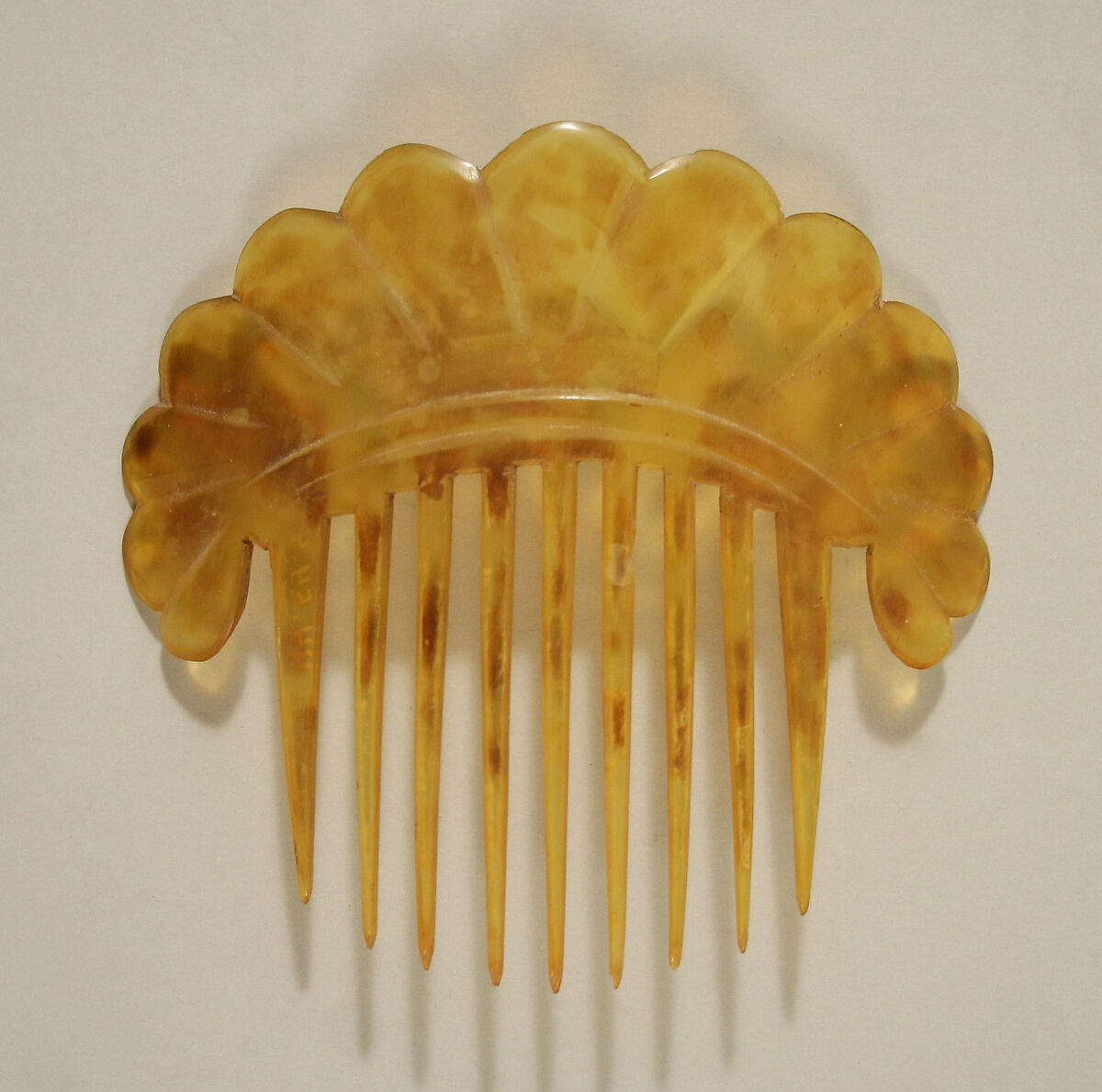 Comb, plastic (cellulose nitrate), American 