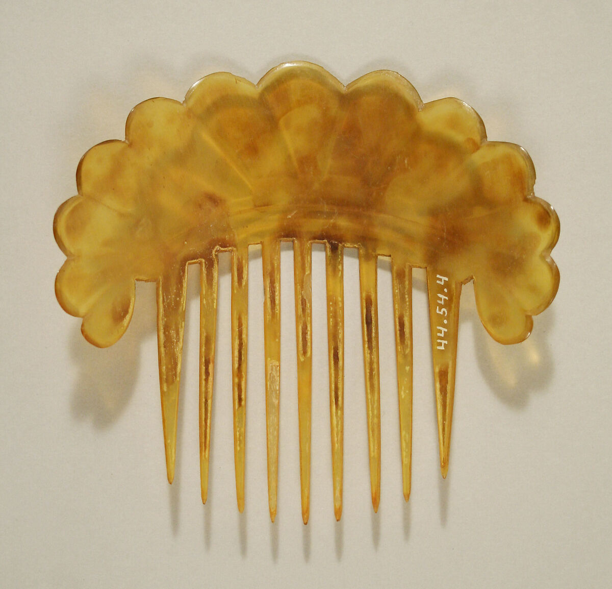 Comb, plastic (cellulose nitrate), American