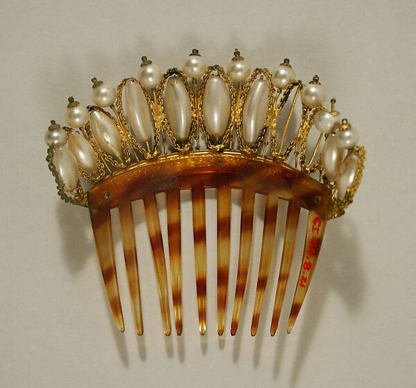 Comb, plastic (cellulose nitrate), metal, European