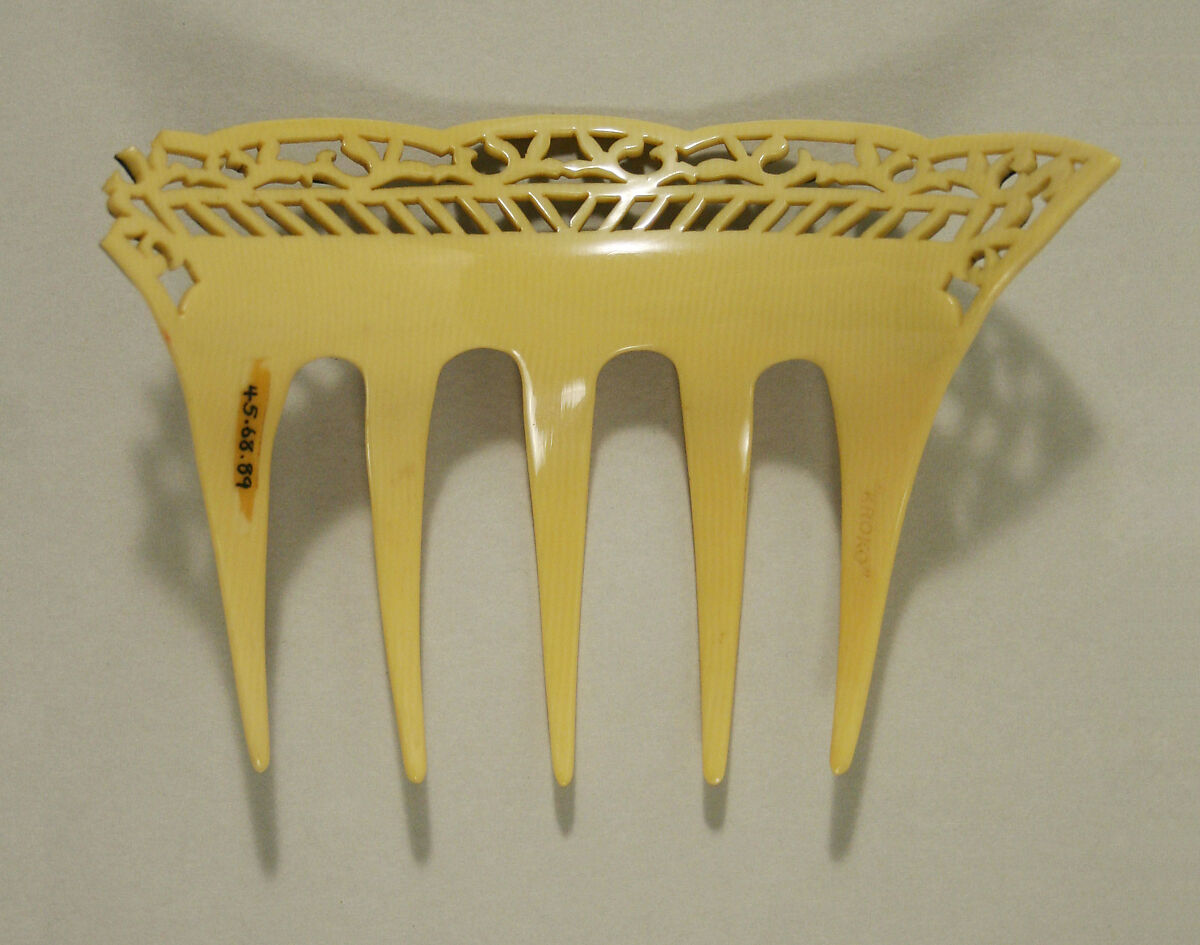 Comb, plastic (cellulose nitrate), American