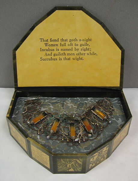 "Incubus", Simon Costin (British, born 1963), a) silver, copper, glass, baroque pearls and human sperm; b) paper, laminate, silk, British