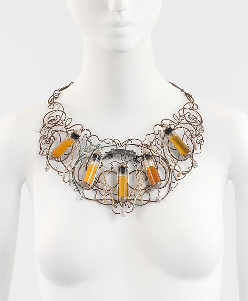 "Incubus", Simon Costin (British, born 1963), a) silver, copper, glass, baroque pearls and human sperm; b) paper, laminate, silk, British