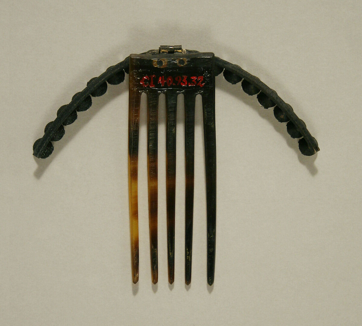 Comb, plastic (cellulose nitrate), metal, American