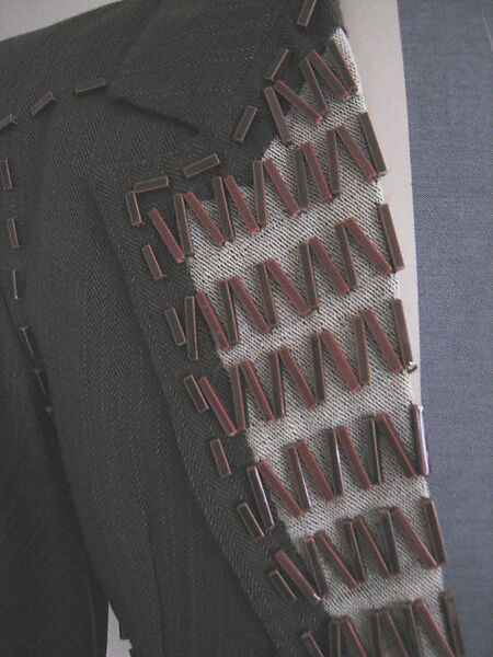 Suit, Vivienne Westwood (British, 1941–2022), a) wool, cotton, ceramic, plastic; b) wool, plastic, metal; c) linen, British