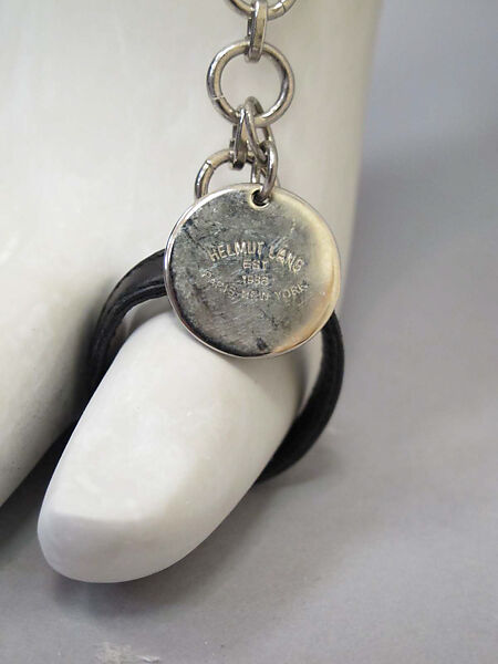 Ensemble, Helmut Lang (Austrian, born 1956), (a) cotton, synthetic; (b) cotton; (c) cotton, silver metal, synthetic; (d, e) leather, synthetic; (f) leather, sterling silver, Austrian