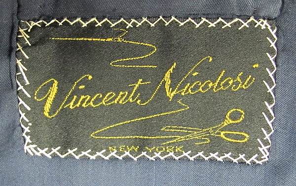 Suit, (a) wool; (b) wool; (c) silk; (d) silk, leather, metal; (e) cotton; (f) metal; (g, h) metal, enamel; (i) silk; (j, k) cotton, synthetic; (l, m) silk, leather, metal; (n, o) leather; (p) wool, silk, leather; (q) wood, rubber., American