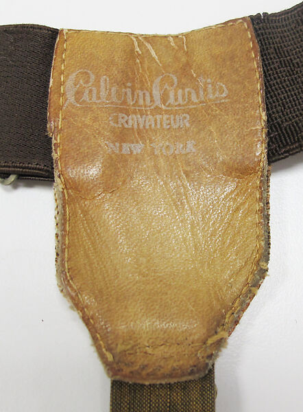 Suit, (a) wool; (b) wool; (c) silk; (d) silk, leather, metal; (e) cotton; (f) metal; (g, h) metal, enamel; (i) silk; (j, k) cotton, synthetic; (l, m) silk, leather, metal; (n, o) leather; (p) wool, silk, leather; (q) wood, rubber., American