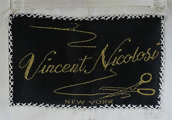 Suit, (a) linen; (b) linen, metal; (c) silk; (d) silk, leather, metal; (e) cotton; (f) metal; (g, h) metal, enamel; (i) silk; (j, k) cotton; (l, m) leather; (n) wool, silk, leather; (o) enamel, synthetic., American