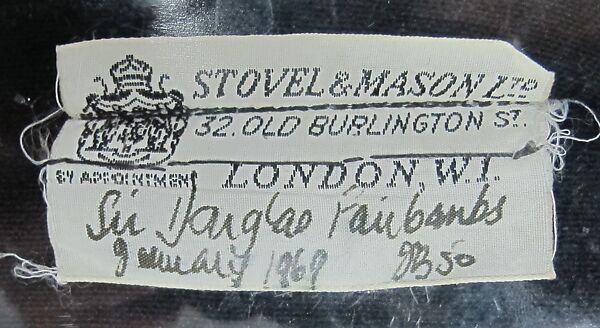 Suit, wool, silk, synthetic, metal, mother-of-pearl, British