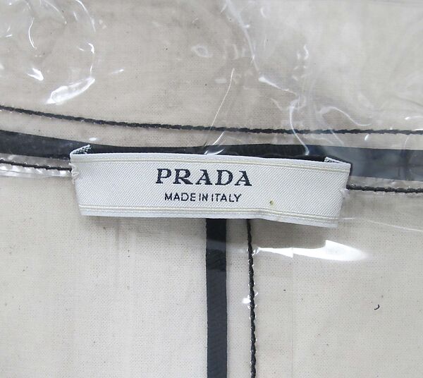 Raincoat, Prada (Italian, founded 1913), plastic (vinyl), silk, leather, metal, Italian