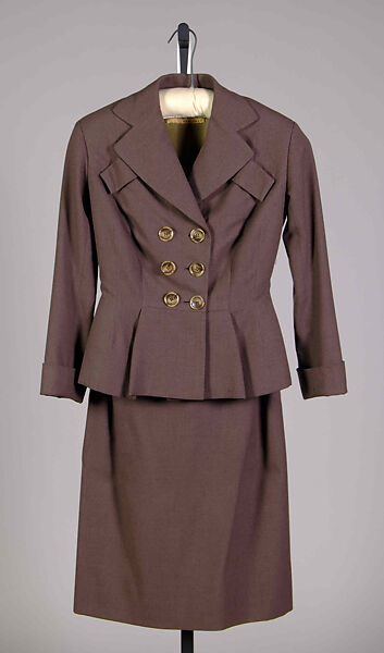 Suit, Elizabeth Arden (American, founded 1908), Wool
a. Jacket: Hip-length; fitted with peplum; double-breasted; notch lapel; turn back cuffs; two angled mock pockets at bust
b. Skirt: Knee-length; straight, American 