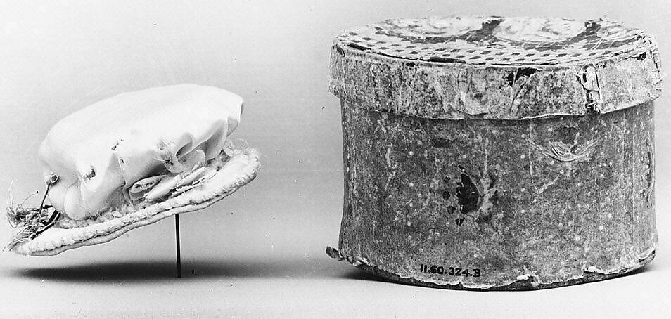 Doll's hat and hatbox, Hat: satin, ribbon, cord
Hatbox: bandbox covered with wallpaper, American 