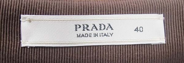 Ensemble, Prada (Italian, founded 1913), (a) wool, synthetic, (b) wool, silk, cotton, metal, (c) leather, metal, (d, e) leather, (f, g) leather, synthetic, metal, (h) leather, silk, metal, (i) leather, metal, Italian