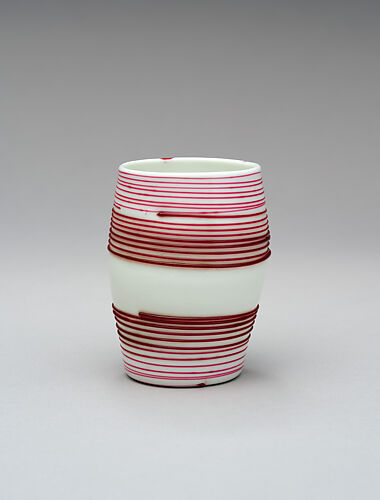 White beaker decorated with red lines