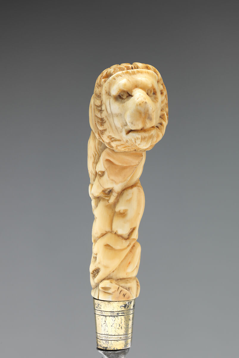 Table knife with handle carved with lion's head, Steel, ivory, brass, possibly German, Saxony