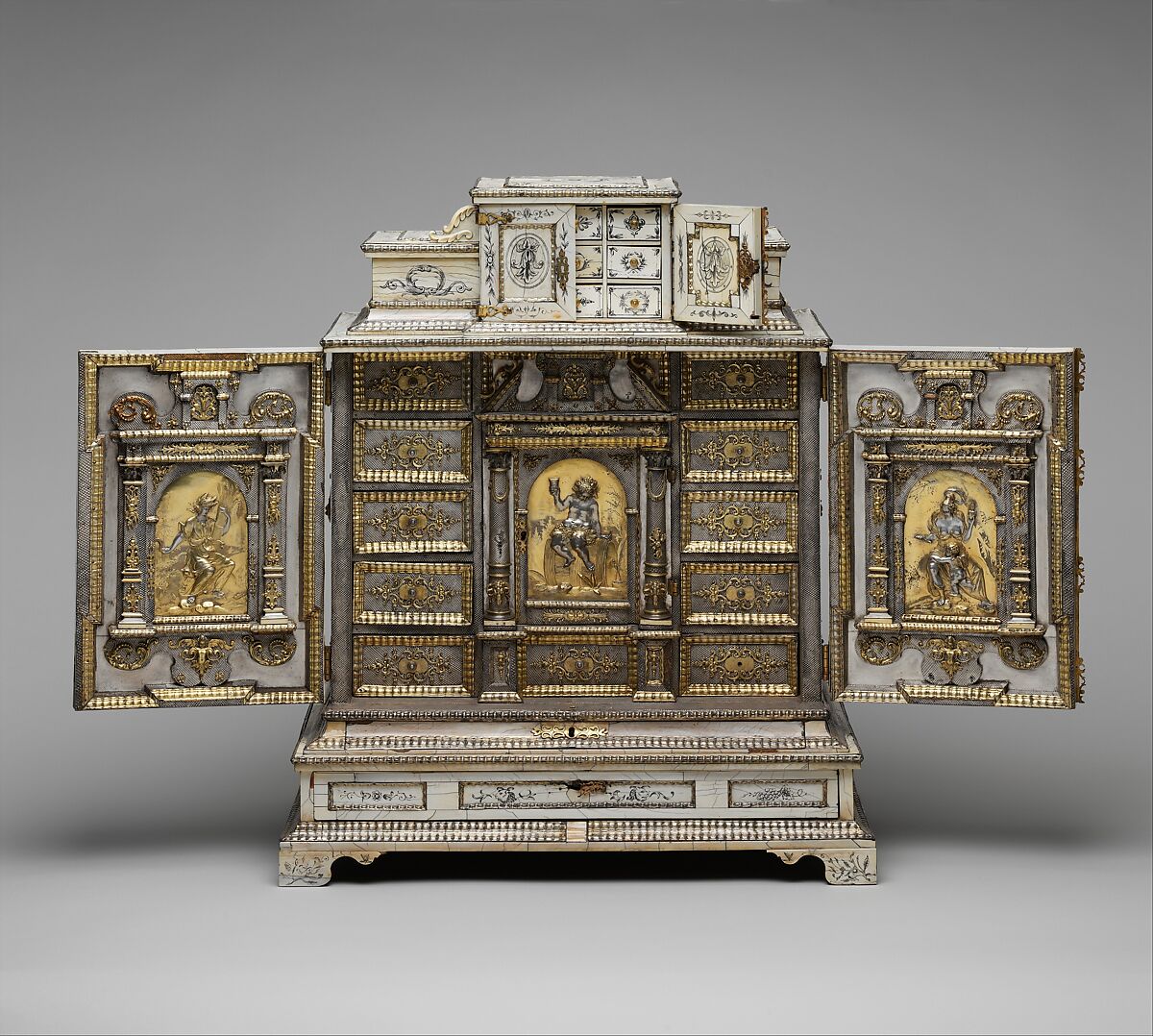 Cabinet, Melchior Baumgartner (1621–1686) German, Oak, pine, walnut, cedar, ebony, and rosewood; ivory veneer and silver veneer; silver; silver-gilt moldings; gilded yellow-metal mounts; the drawers lined with aquamarine-colored silk, German, Augsburg