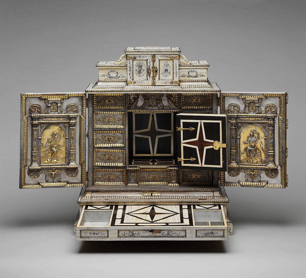 Cabinet, Cabinetry by the workshop of Melchior Baumgartner (German) (1621–1686), Oak, pine, walnut, cedar, ebony, and rosewood; ivory veneer and silver veneer; silver; silver-gilt moldings; gilded yellow-metal mounts; the drawers lined with aquamarine-colored silk, German, Augsburg