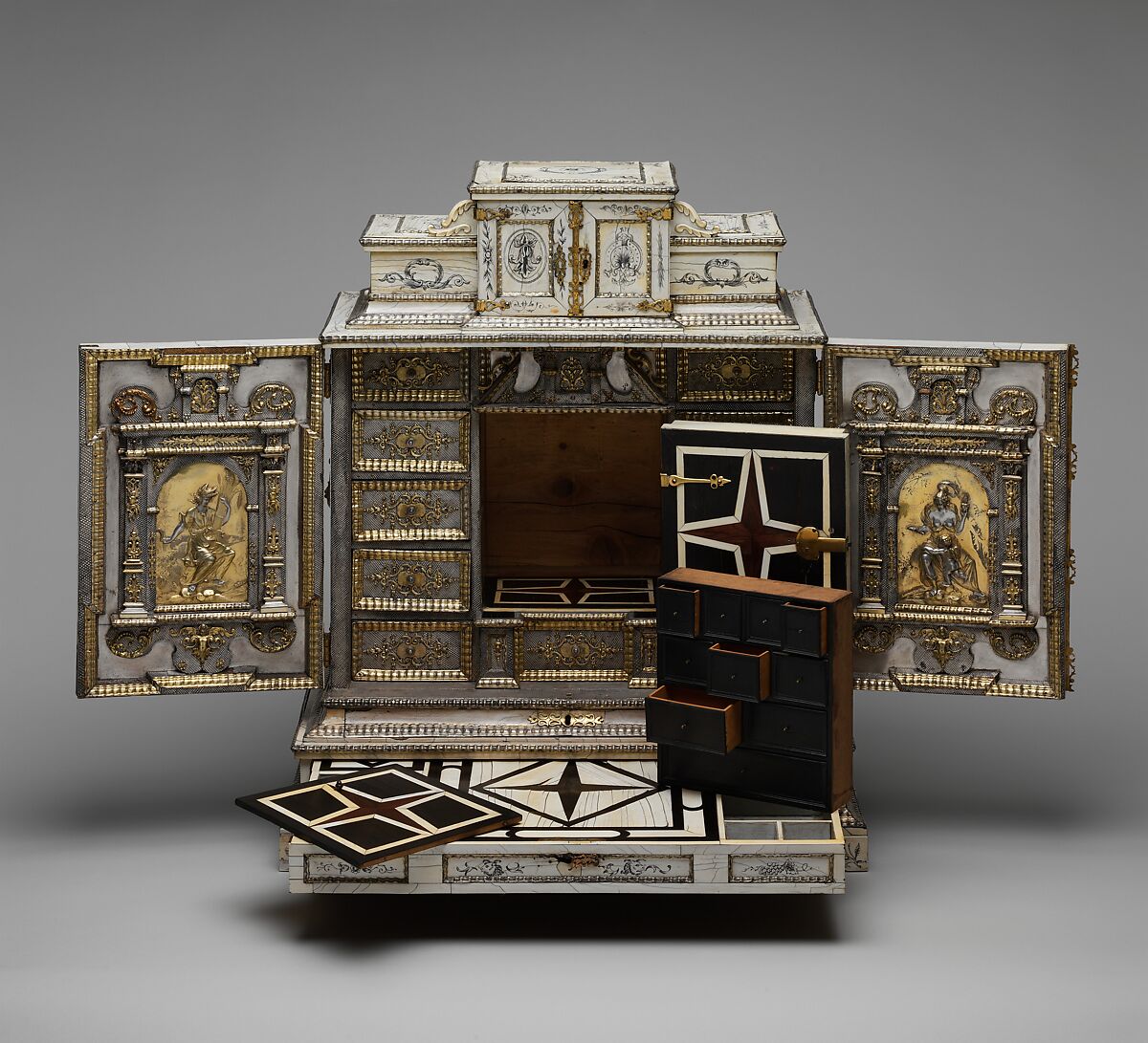 Cabinet, Cabinetry by the workshop of Melchior Baumgartner (German) (1621–1686), Oak, pine, walnut, cedar, ebony, and rosewood; ivory veneer and silver veneer; silver; silver-gilt moldings; gilded yellow-metal mounts; the drawers lined with aquamarine-colored silk, German, Augsburg