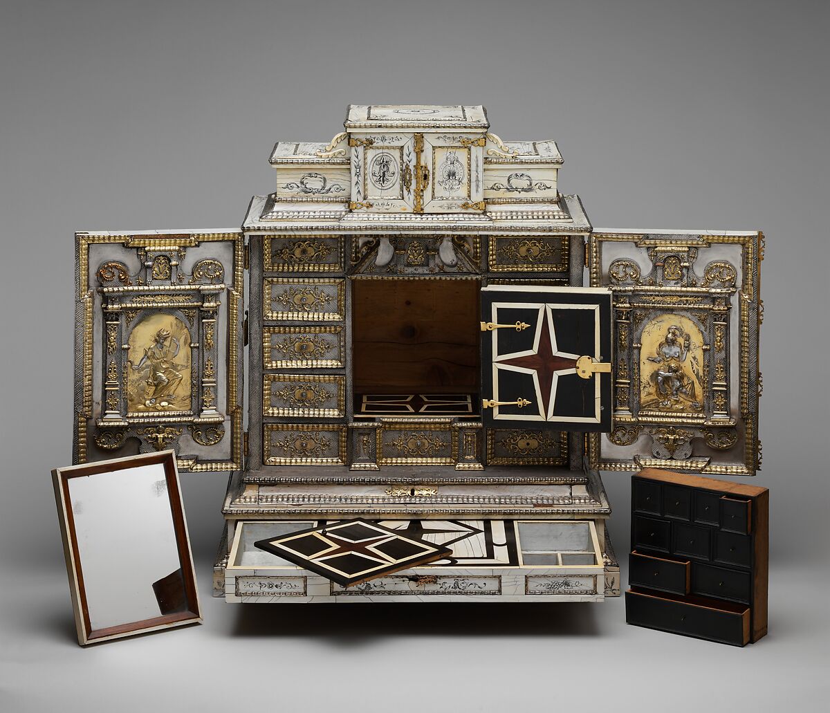 Cabinet, Cabinetry by the workshop of Melchior Baumgartner (German) (1621–1686), Oak, pine, walnut, cedar, ebony, and rosewood; ivory veneer and silver veneer; silver; silver-gilt moldings; gilded yellow-metal mounts; the drawers lined with aquamarine-colored silk, German, Augsburg