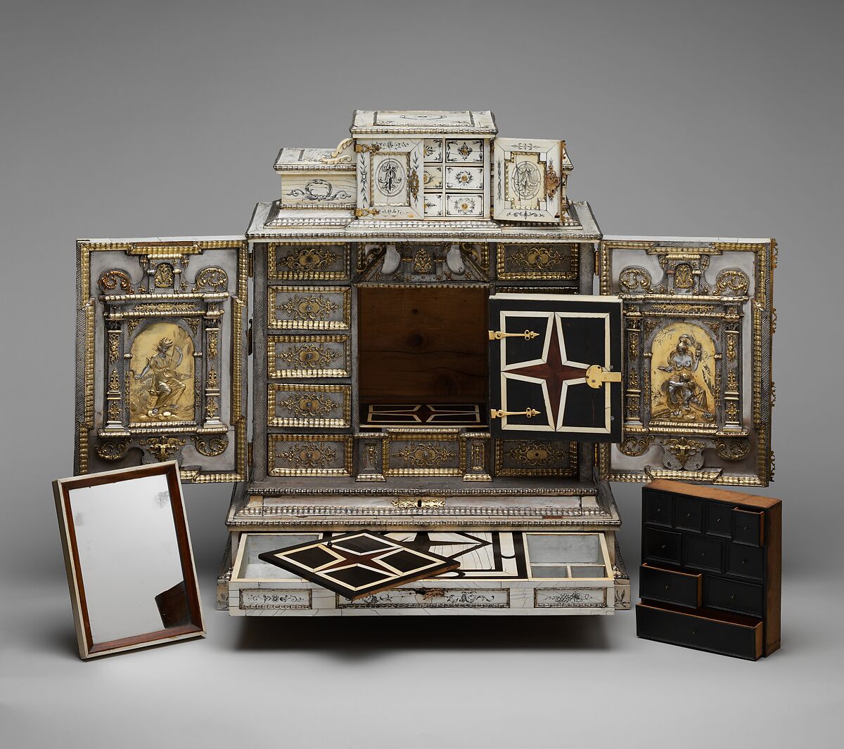Cabinet, Cabinetry by the workshop of Melchior Baumgartner (German) (1621–1686), Oak, pine, walnut, cedar, ebony, and rosewood; ivory veneer and silver veneer; silver; silver-gilt moldings; gilded yellow-metal mounts; the drawers lined with aquamarine-colored silk, German, Augsburg