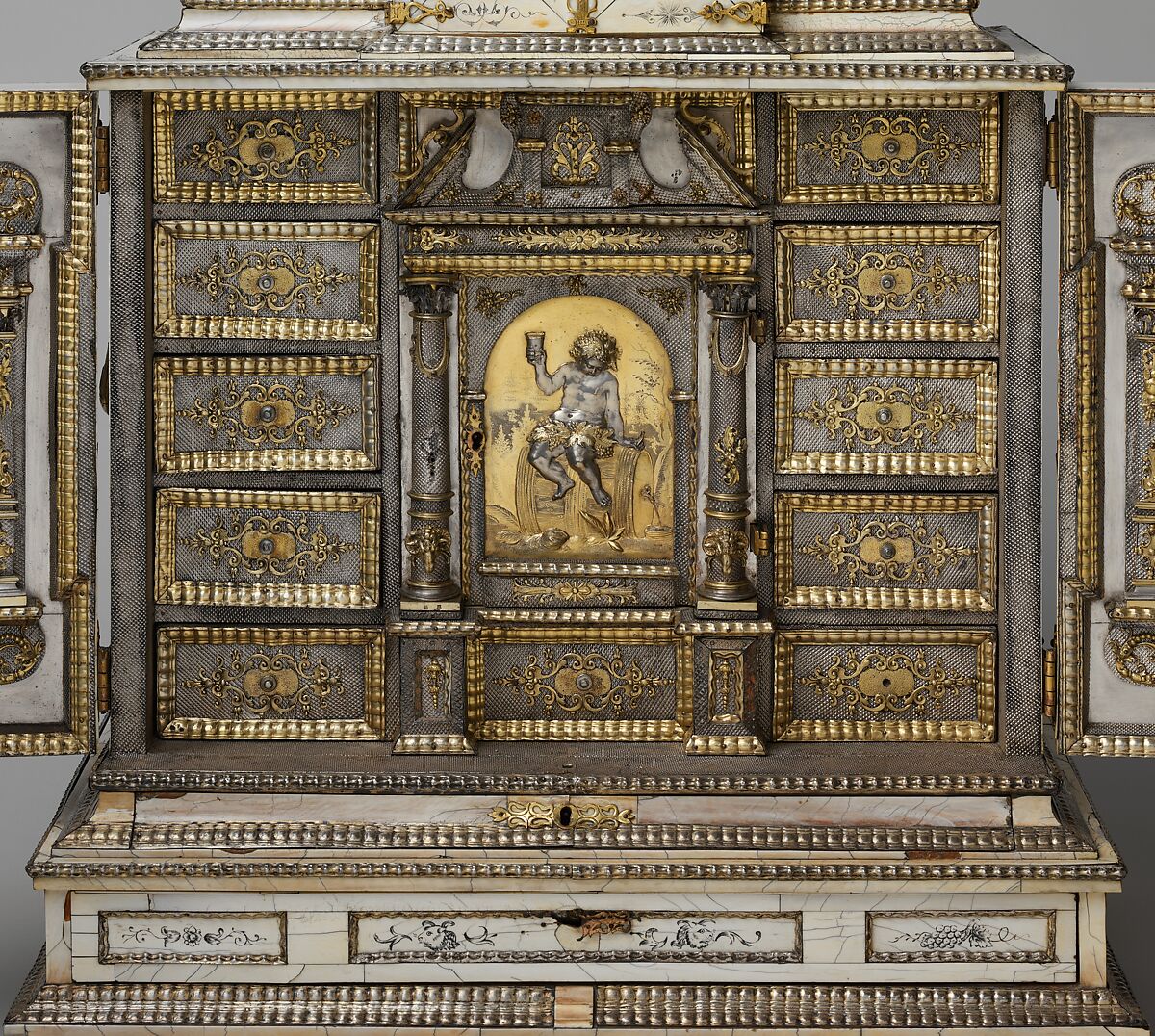 Cabinet, Cabinetry by the workshop of Melchior Baumgartner (German) (1621–1686), Oak, pine, walnut, cedar, ebony, and rosewood; ivory veneer and silver veneer; silver; silver-gilt moldings; gilded yellow-metal mounts; the drawers lined with aquamarine-colored silk, German, Augsburg